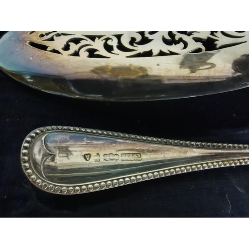 129 - Two cased large serving spoons and a fish serving set