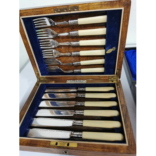 137 - Two sets of silver plated fish knives and forks beautifully presented in their original boxes, one o... 