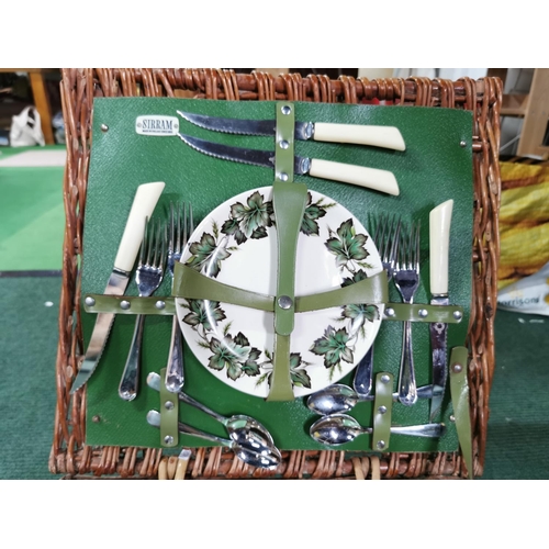 14 - Wicker picnic basket containing  Sirram picnic set inc two thermos flasks cups saucers cutlery etc