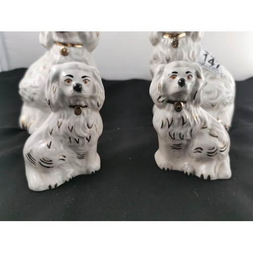 147 - Four Royal Doulton Staffordshire seated dogs, tallest dog is 15cm tall in good order