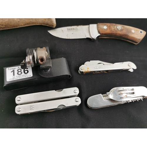 186 - Quantity of seven various knives inc a Sauer hunting knife, a folding Opinel France knife, multi too... 