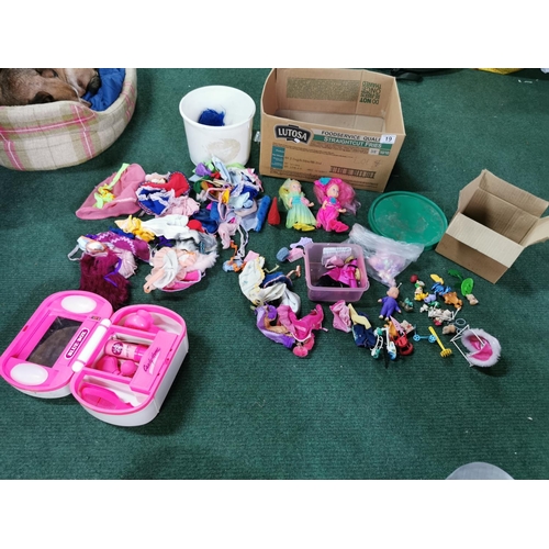 19 - Box full of dolls clothes along with a quantity of dolls