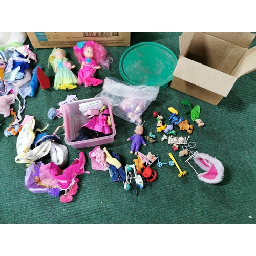 19 - Box full of dolls clothes along with a quantity of dolls