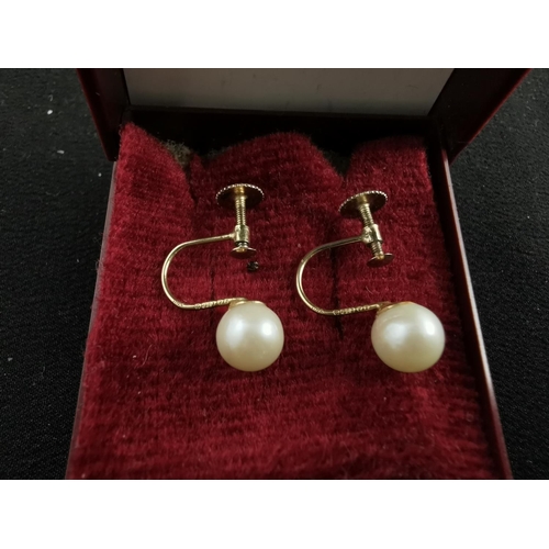 193 - Pair of 9ct gold genuine pearl screw back earrings