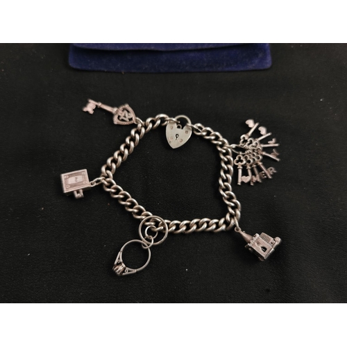 200 - 925 silver charm bracelet with 5 charms total weight of 31.2 grams