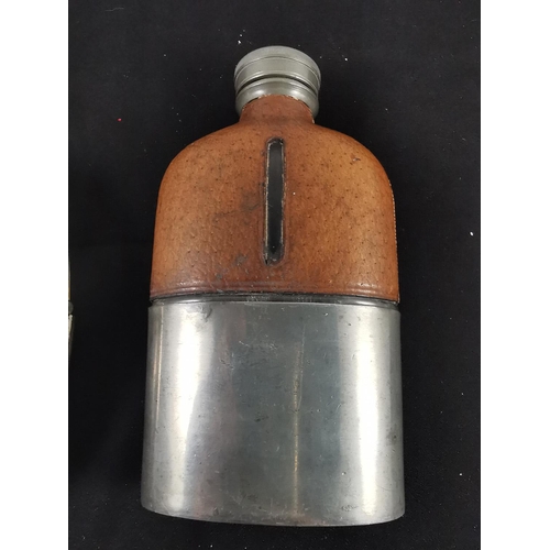 210 - Two antique plated hip flasks