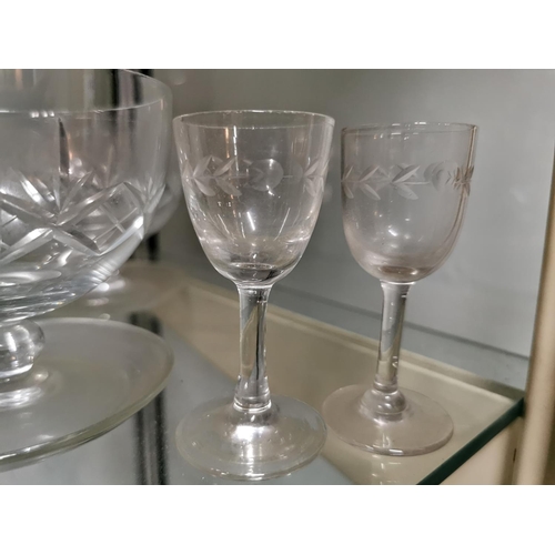 243 - Quantity of crystal glassware inc five grapefruit bowls and two decanters, one decanter has a chip.