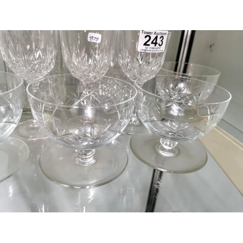 243 - Quantity of crystal glassware inc five grapefruit bowls and two decanters, one decanter has a chip.