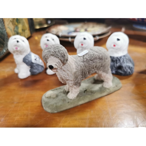 272 - Four small stone ware English sheep dog figures and one other figure, each dog figure is 9cm tall