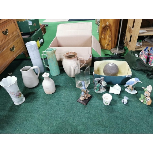 29 - Large quantity of vases and jugs along with a box of bird figures etc