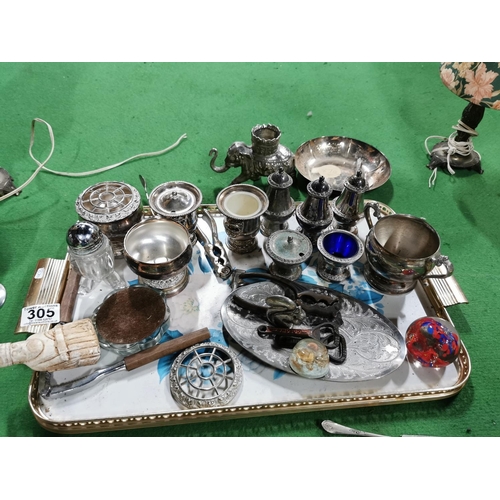 305 - Tray full of metal and plated ware inc a glass bottom brass stein, pair of lamps, condiment sets etc