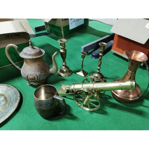 309 - Two boxes full of brass and copper ware inc a brass canon three teapots enamelled egg solid brass ca... 