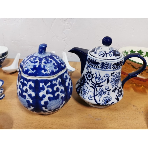 320 - Quantity of blue and white oriental china inc lidded pots, teapots, bowls, Saki set etc