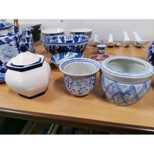 320 - Quantity of blue and white oriental china inc lidded pots, teapots, bowls, Saki set etc