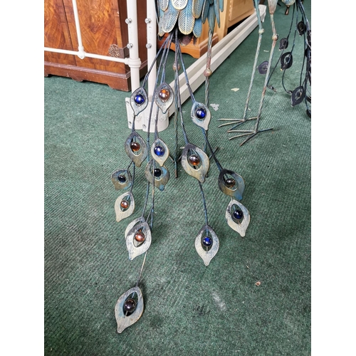 419 - Pair of tall metal garden ornaments with glass bead tails 94cm tall by 63cm