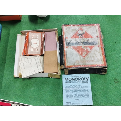 42 - Large box of odds inc quantity of coloured glassware and various board games inc an early 1940's Mon... 