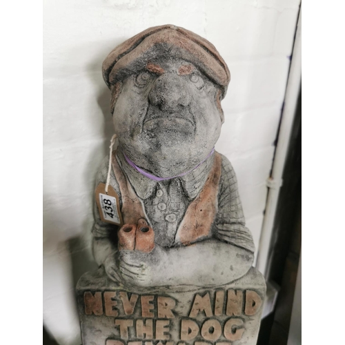 438 - Tall stone ware figure holding a sign never mind the dog beware of the owner 52cm high by 23cm wide