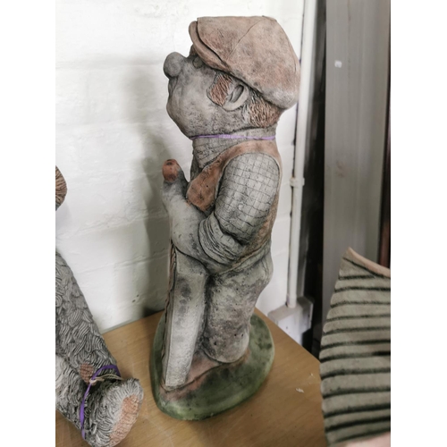 438 - Tall stone ware figure holding a sign never mind the dog beware of the owner 52cm high by 23cm wide