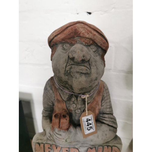 445 - Tall stone ware figure holding a sign never mind the dog beware of the owner 52cm high by 23cm wide