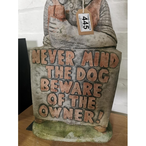 445 - Tall stone ware figure holding a sign never mind the dog beware of the owner 52cm high by 23cm wide