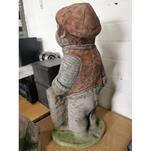 445 - Tall stone ware figure holding a sign never mind the dog beware of the owner 52cm high by 23cm wide