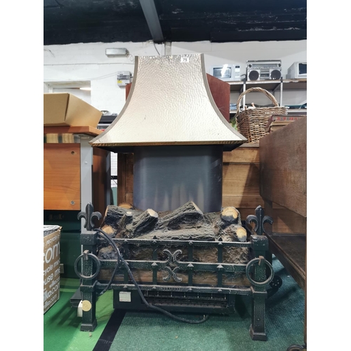 75 - Large electric fire in a cast iron basket with an ornate flue to the top, 111cm high by 64cm wide an... 