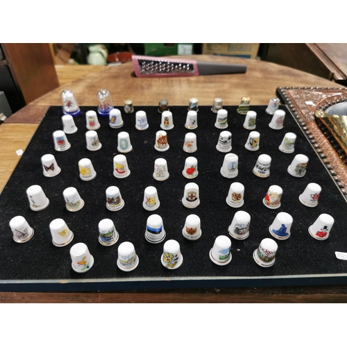 99 - Approx. 54 collectable thimbles stand is not included