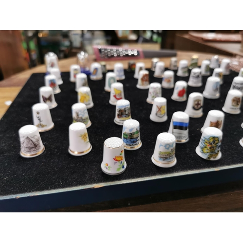 99 - Approx. 54 collectable thimbles stand is not included