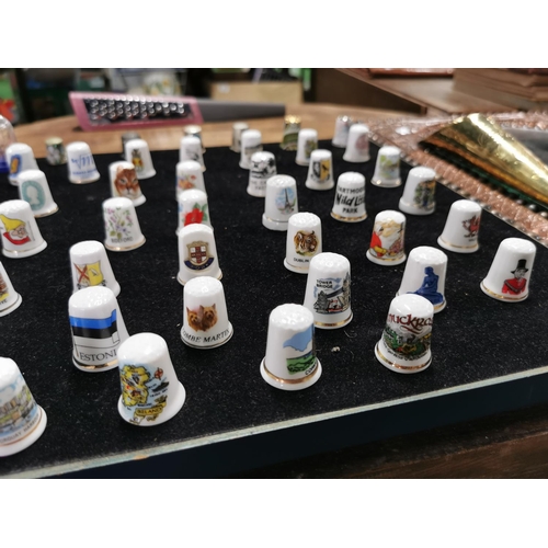 99 - Approx. 54 collectable thimbles stand is not included