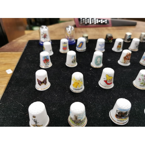 99 - Approx. 54 collectable thimbles stand is not included