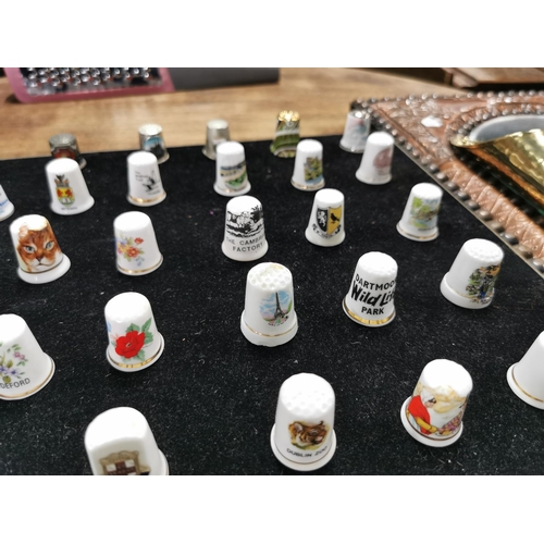 99 - Approx. 54 collectable thimbles stand is not included