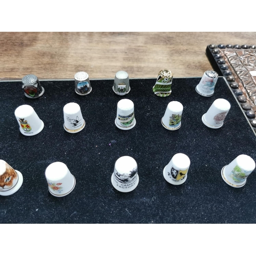 99 - Approx. 54 collectable thimbles stand is not included