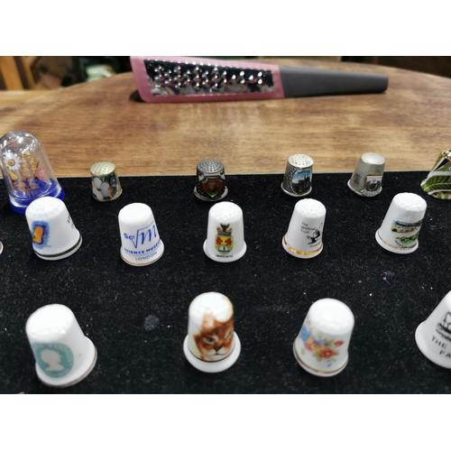 99 - Approx. 54 collectable thimbles stand is not included