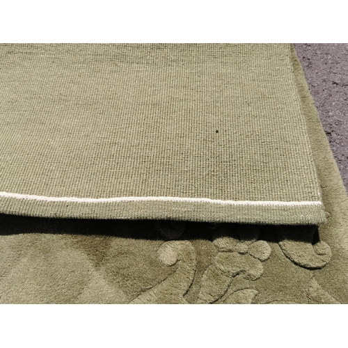 150j - Pair of green very thick pile rugs in good clean condition 155cm by 94cm each