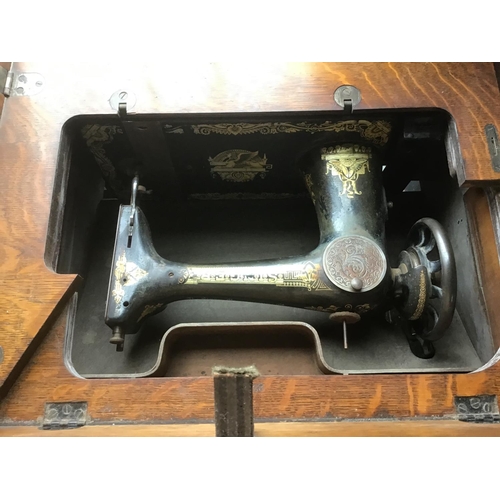 355 - Antique Singer treadle sewing machine table complete with its machine