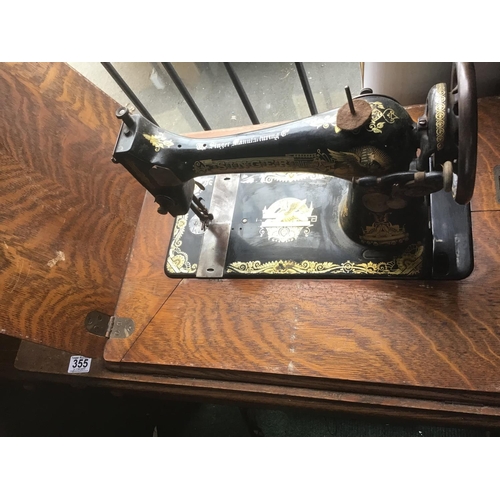 355 - Antique Singer treadle sewing machine table complete with its machine