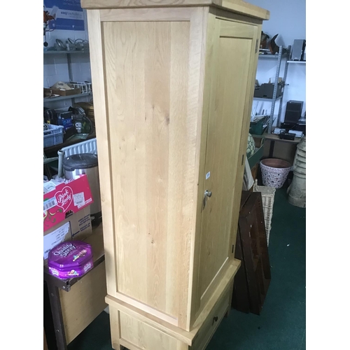 359 - New old stock Solid Oak single door wardrobe with one drawer to base and full hanging
separates into... 