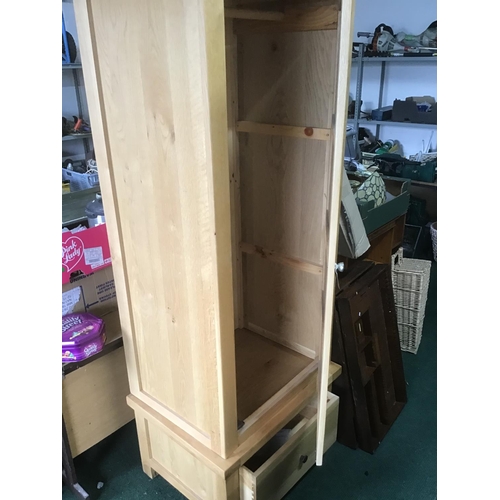 359 - New old stock Solid Oak single door wardrobe with one drawer to base and full hanging
separates into... 