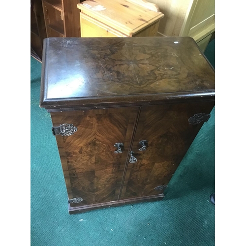 364 - 2 Door lockable cupboard walnut with original key
92cm tall 58cm wide 33cm deep