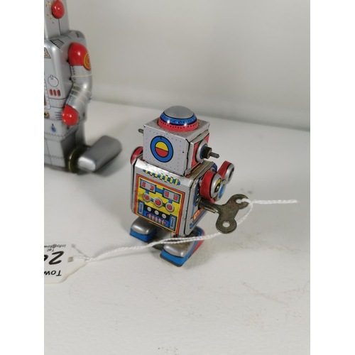 200e - Three vintage tin plate windup robots