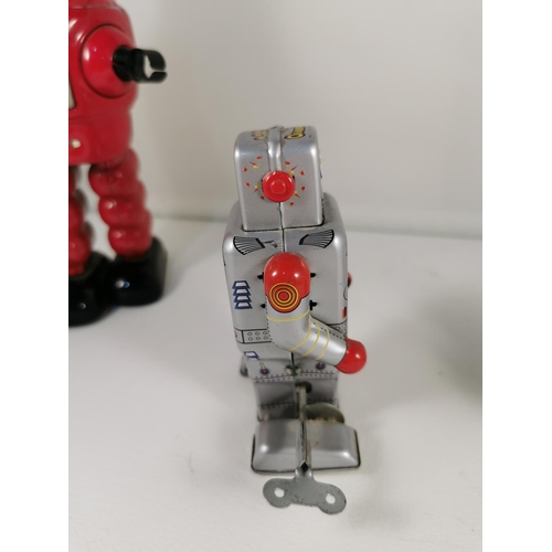 200e - Three vintage tin plate windup robots