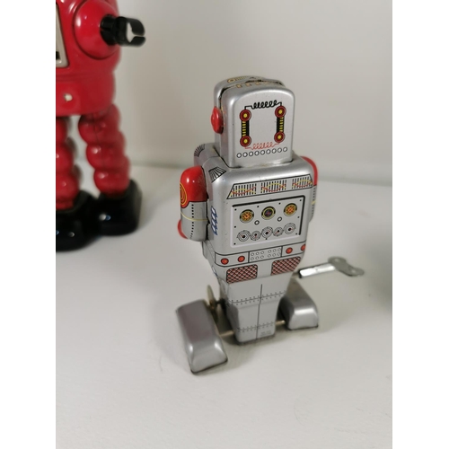 200e - Three vintage tin plate windup robots