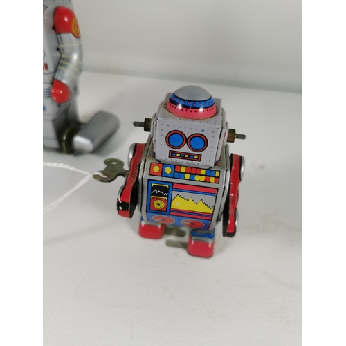 200e - Three vintage tin plate windup robots