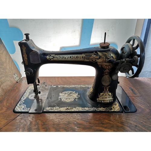 355 - Antique Singer treadle sewing machine table complete with its machine