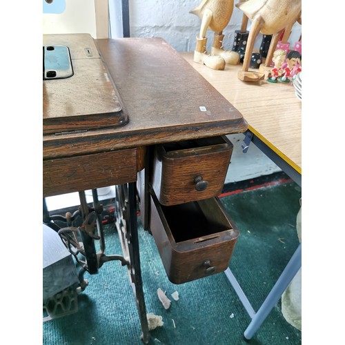 355 - Antique Singer treadle sewing machine table complete with its machine