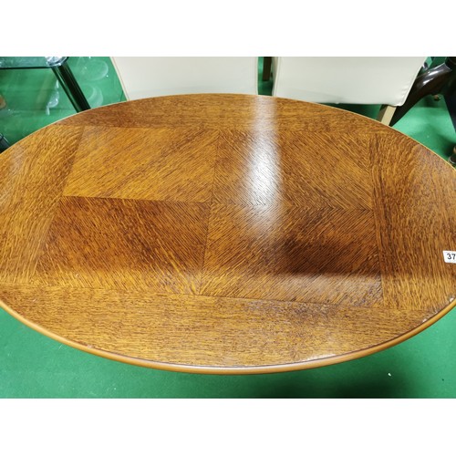 375 - Oak oval coffee table with Queen Ann legs clean top presenting a good grain 44cm high, 66cm wide, 11... 