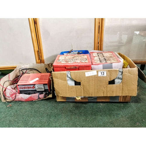 13 - Large quantity of screws in containers plus a car  battery charger drill bits etc