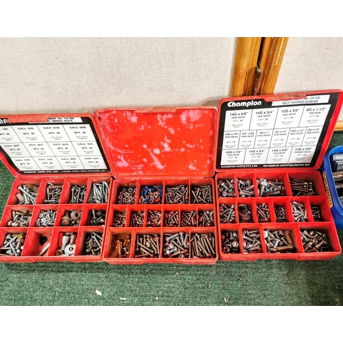 13 - Large quantity of screws in containers plus a car  battery charger drill bits etc