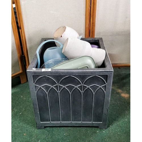 38 - Planter full of plant pots