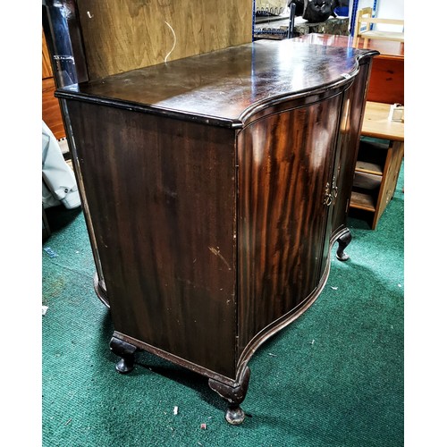486 - Serpentine solid mahogany cabinet stamped W. Fowkes on top of the doors